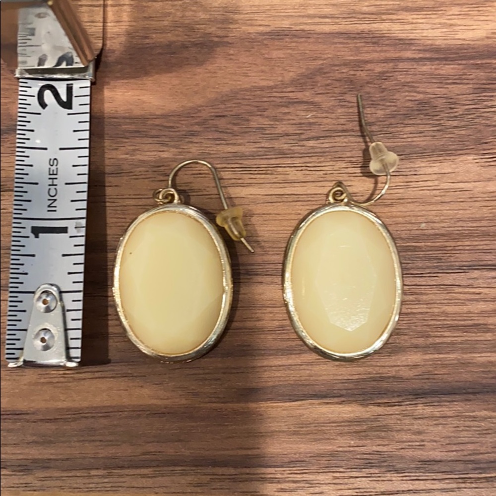 Ivory oval faceted earrings. Gold tone